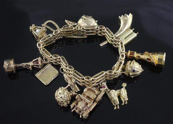 A Russian 56 zolotnik gold charm bracelet, hung with thirteen assorted mainly 9ct gold charms,